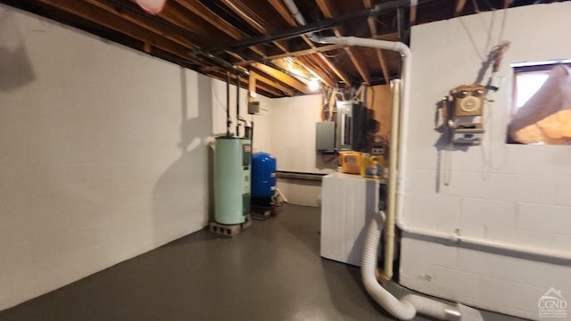 basement featuring electric panel and gas water heater