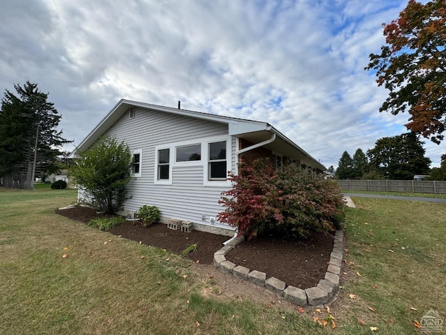 view of home's exterior featuring a lawn