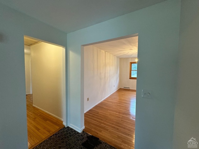 hallway featuring hardwood / wood-style floors