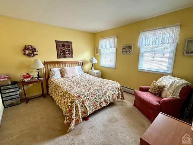 bedroom featuring a baseboard heating unit and carpet