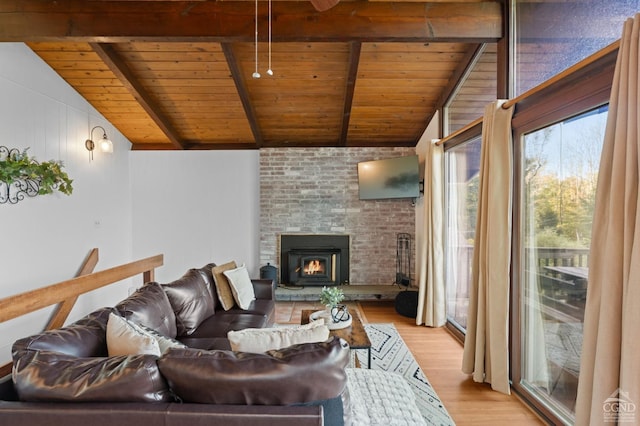 living room with light wood-type flooring, lofted ceiling with beams, and wood ceiling