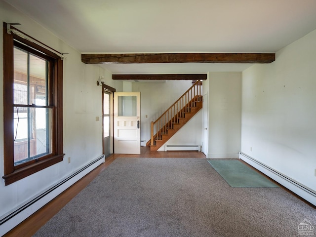 empty room with beam ceiling, a baseboard radiator, and hardwood / wood-style flooring