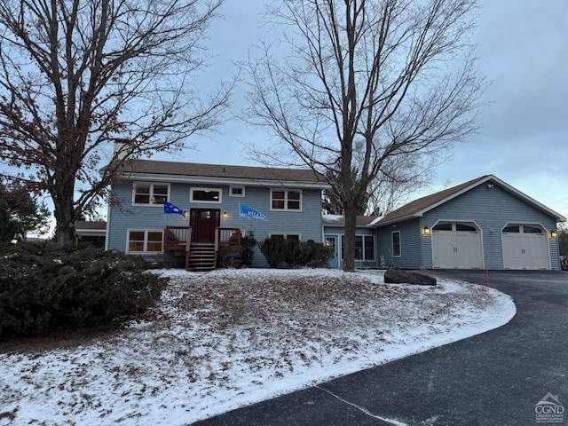 split foyer home featuring a garage