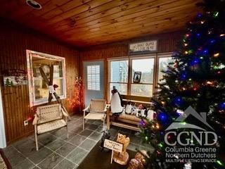 sunroom / solarium with wooden ceiling