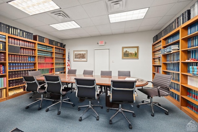 carpeted office with visible vents and a paneled ceiling