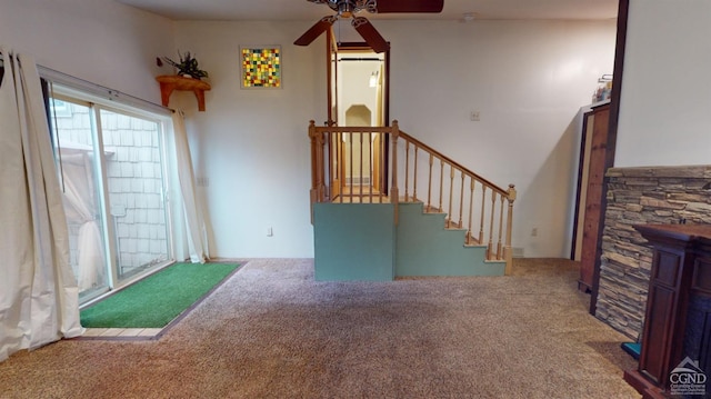 carpeted living room featuring ceiling fan