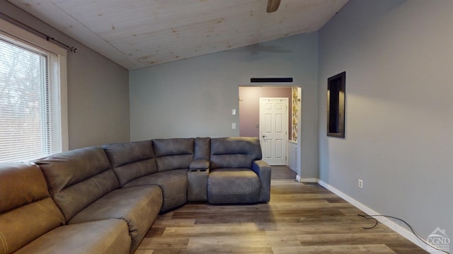 living room featuring vaulted ceiling and light wood-type flooring