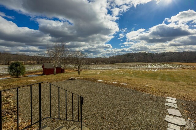 view of yard with a rural view
