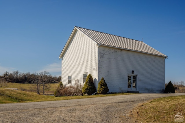 view of side of home with french doors