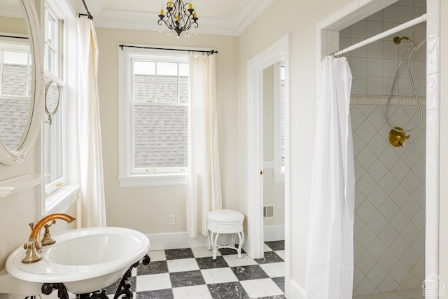 bathroom featuring crown molding, sink, a chandelier, and a shower with shower curtain