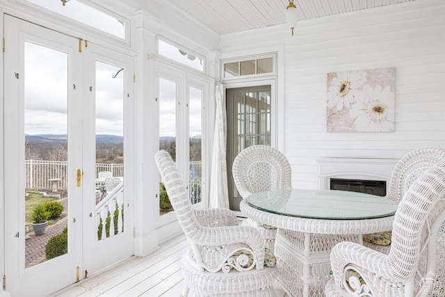 sunroom / solarium featuring wooden ceiling