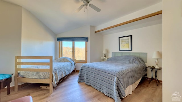 bedroom featuring ceiling fan, wood-type flooring, and vaulted ceiling