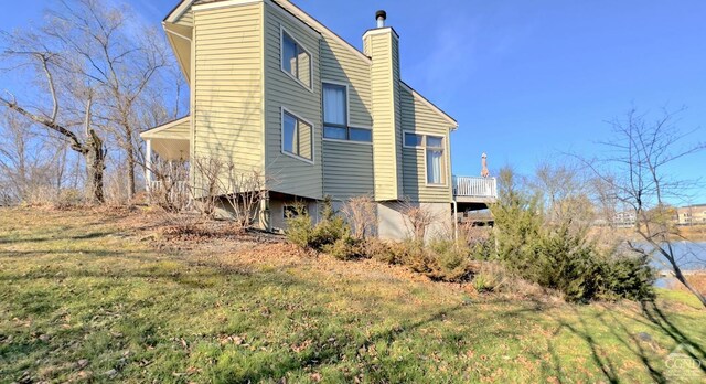 view of home's exterior featuring a lawn