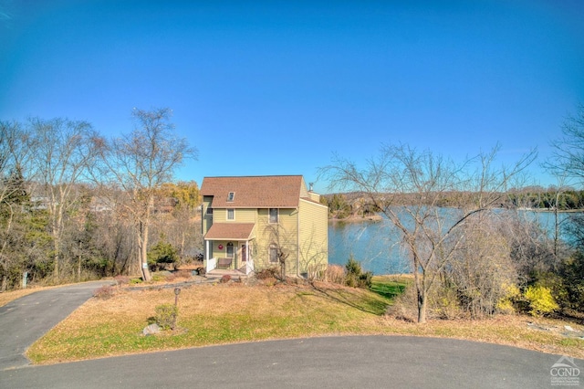 view of front of house featuring a water view