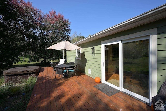 deck with a hot tub