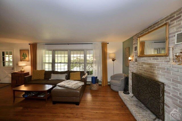 dining room featuring a wall unit AC, a notable chandelier, and light wood-type flooring