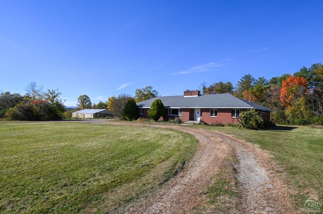 ranch-style house featuring a front lawn