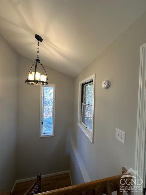 stairs featuring lofted ceiling