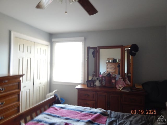 bedroom with a closet and a ceiling fan