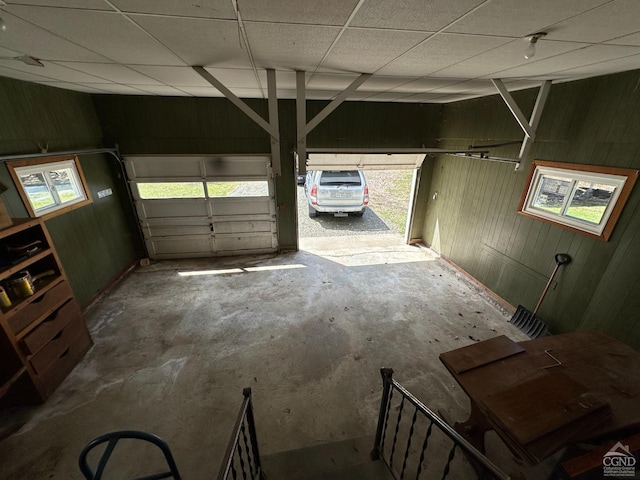 garage featuring wood walls