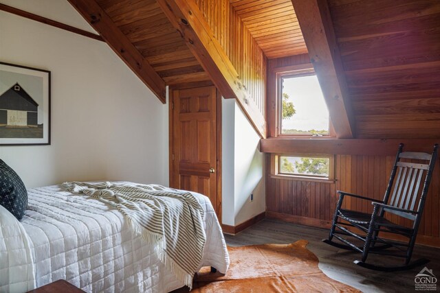 bedroom featuring hardwood / wood-style flooring, lofted ceiling with beams, wooden walls, and multiple windows