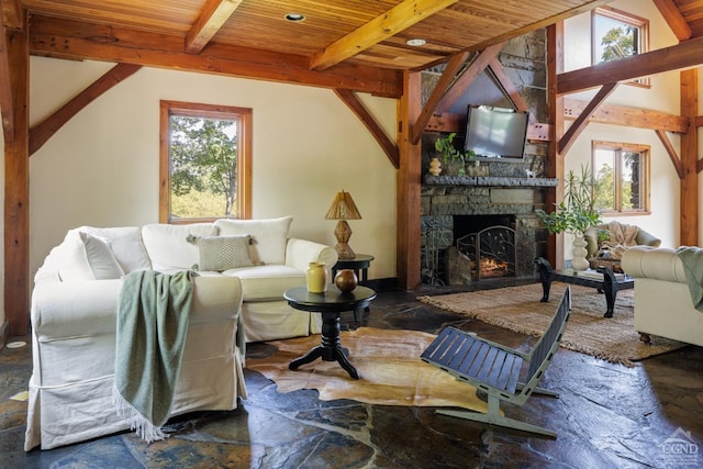 living room with a fireplace, vaulted ceiling with beams, and wooden ceiling