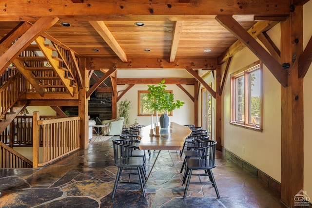 dining area with beam ceiling and wooden ceiling