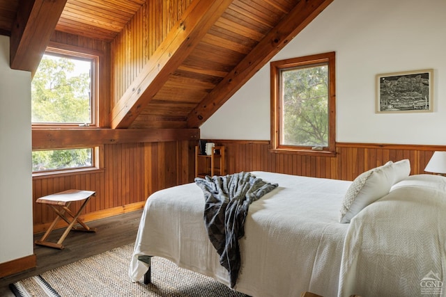 bedroom featuring wooden ceiling, wooden walls, hardwood / wood-style flooring, and lofted ceiling