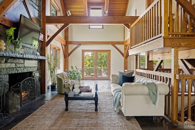 living room featuring beam ceiling, a fireplace, high vaulted ceiling, and wood ceiling