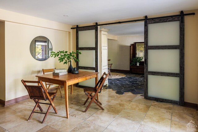 dining area with a barn door