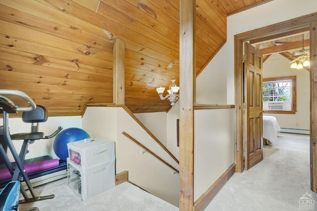 interior space with lofted ceiling, wooden ceiling, carpet floors, and baseboard heating