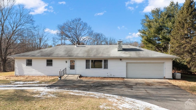 single story home featuring a garage