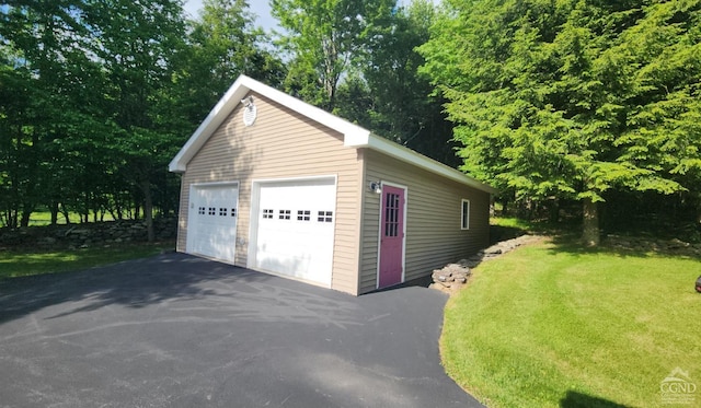 garage featuring a yard