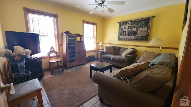 living room with ceiling fan, crown molding, and a wealth of natural light