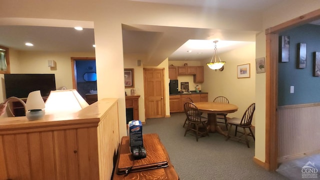 interior space featuring decorative light fixtures and kitchen peninsula