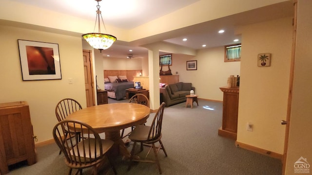 dining space featuring carpet flooring