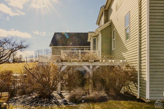 view of side of home featuring a deck
