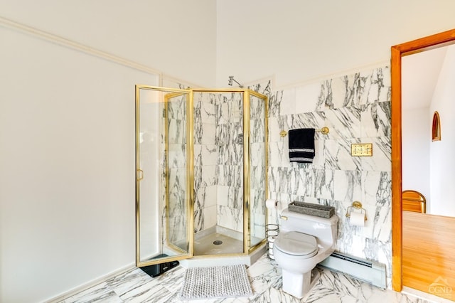 bathroom with toilet, a shower with door, and a baseboard heating unit