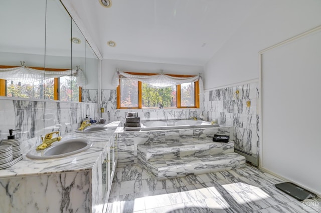 bathroom with tiled bath, sink, lofted ceiling, and a baseboard heating unit