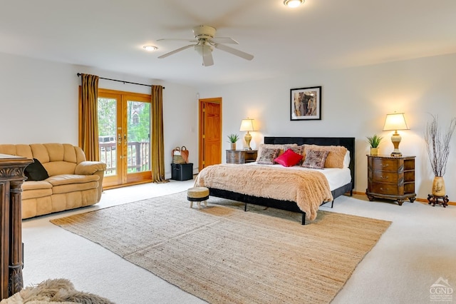 bedroom with access to exterior, french doors, light colored carpet, and ceiling fan