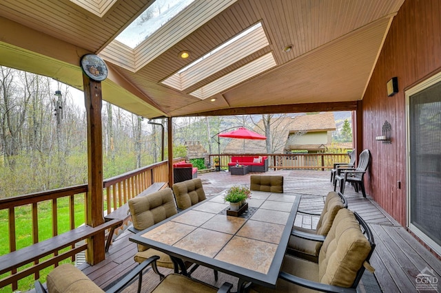 wooden terrace with outdoor lounge area