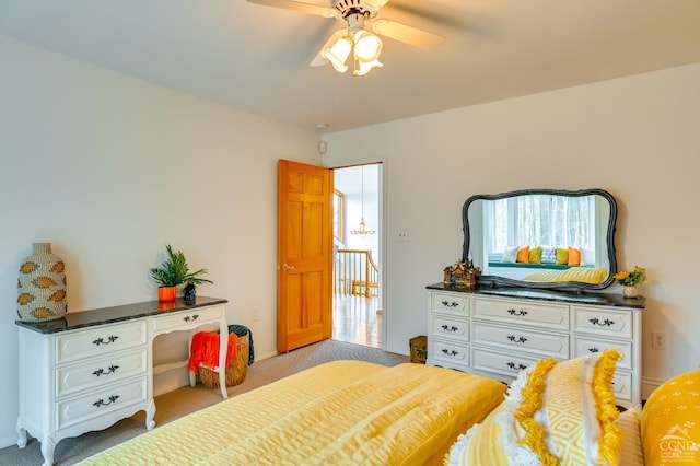 bedroom featuring ceiling fan and light carpet