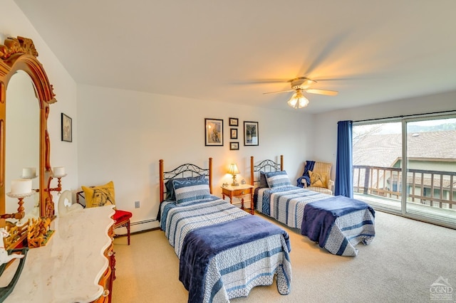 carpeted bedroom with access to outside, ceiling fan, and a baseboard heating unit