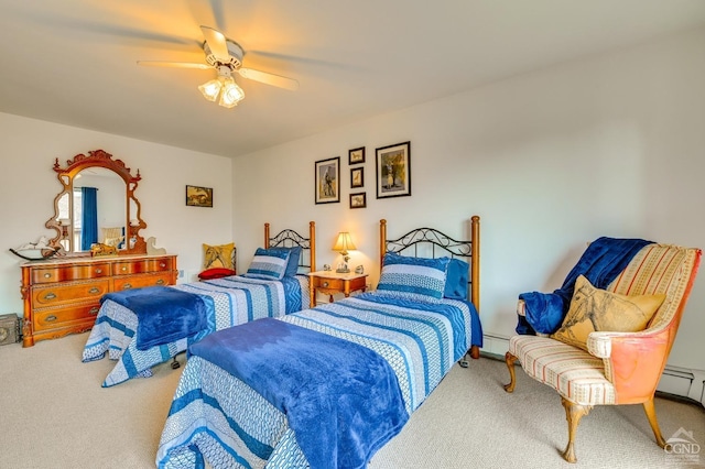 bedroom with carpet flooring, ceiling fan, and a baseboard heating unit