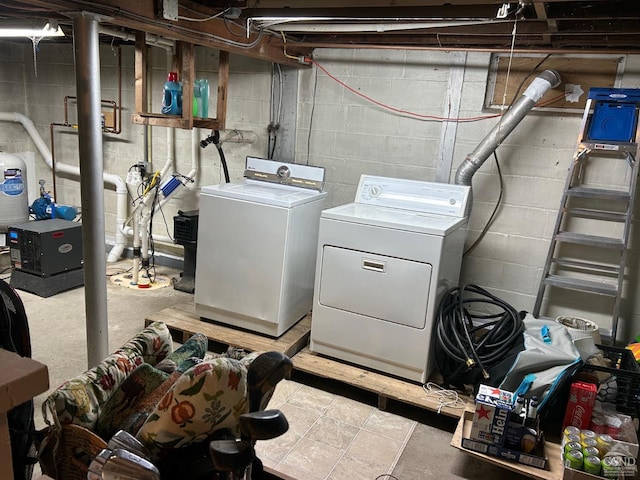 washroom with independent washer and dryer