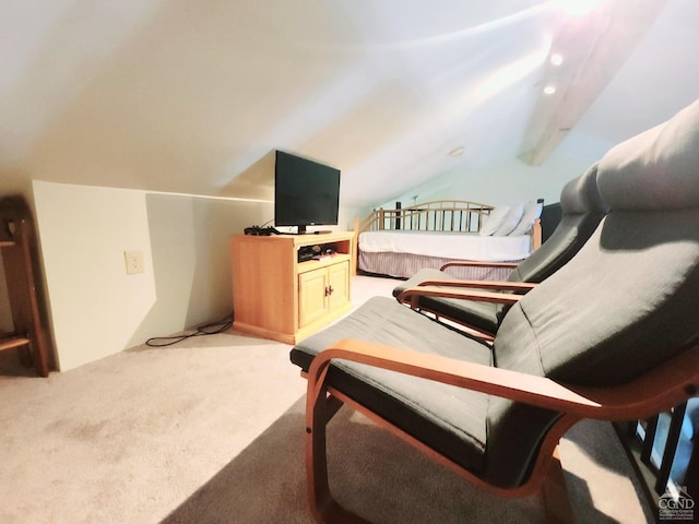 bedroom with lofted ceiling with beams and carpet floors