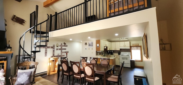 dining space featuring beamed ceiling, recessed lighting, stairway, and high vaulted ceiling