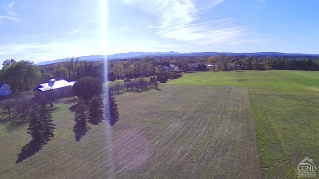 birds eye view of property featuring a mountain view and a rural view