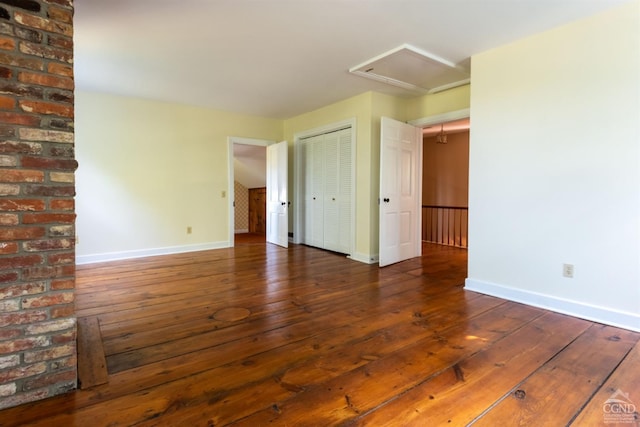 empty room featuring dark wood-type flooring