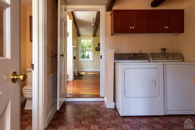 washroom featuring washer and dryer and dark hardwood / wood-style flooring